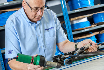 Man manufacturing a conveyor belt